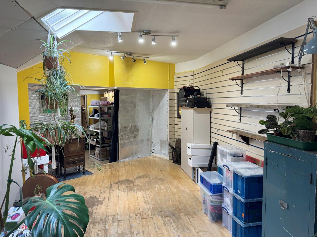 Lot: 69 - SHOP AND TWO-BEDROOM FLAT FOR INVESTMENT OR OWNER OCCUPATION - Ground floor store area to rear